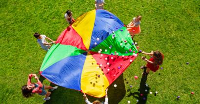 Parachute game to show icebreaker exercises for students